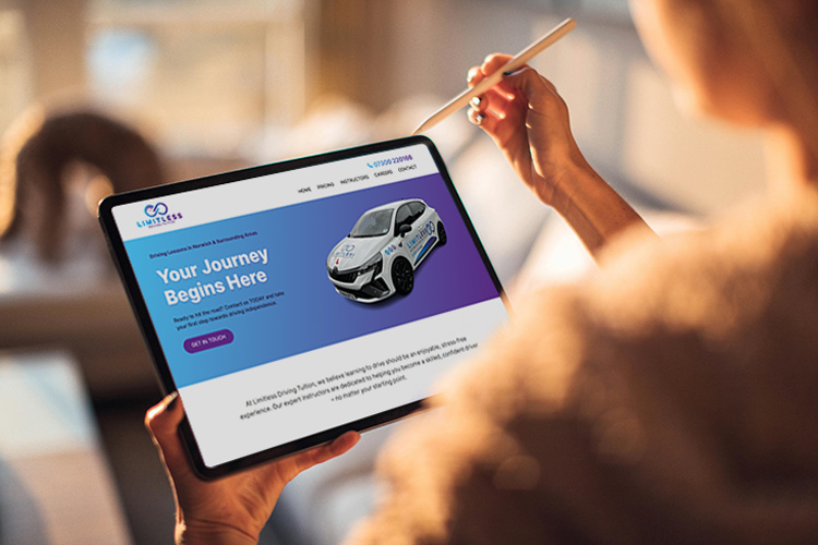 Female holding an iPad looking at the Limitless Driving Tuition website